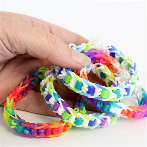 Slip a second band under the first band. . Easy rainbow loom bracelets